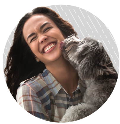 Woman holding a small dog in her lap