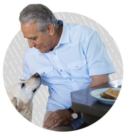 Man with Crohn's smiling next to his dog