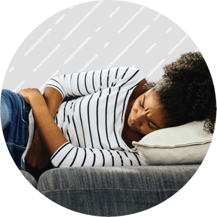 Woman with Crohn's disease holding abdomen in pain